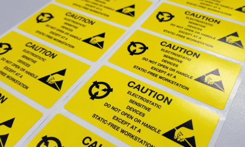 Standard caution label with text "Caution" for Electrostatic Sensitive Devices (ESD) in electronic industrial.