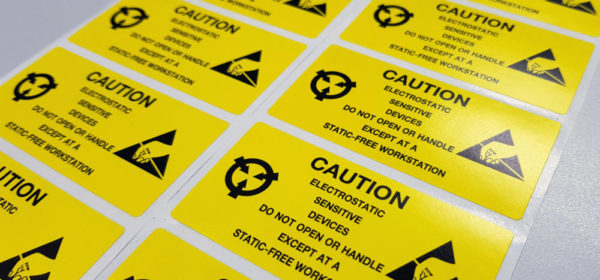 Standard caution label with text "Caution" for Electrostatic Sensitive Devices (ESD) in electronic industrial.